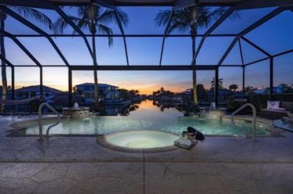 Custom infinity pool  spa with kayaks   Villa Bella del Sol   Roelens Vacations Florida